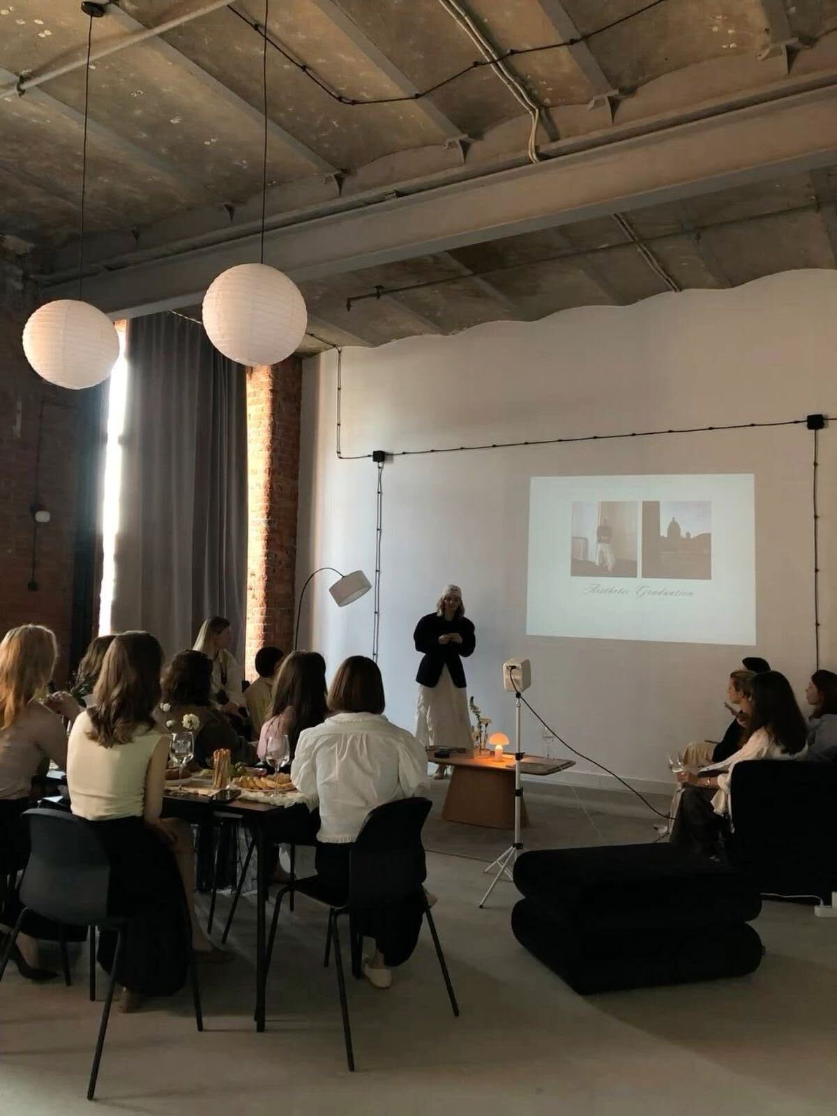 A warm room of women listening to a launch talk
