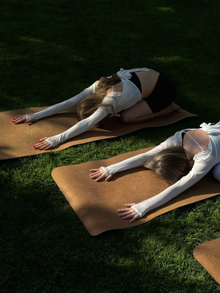 Stretching on mats on the lawn