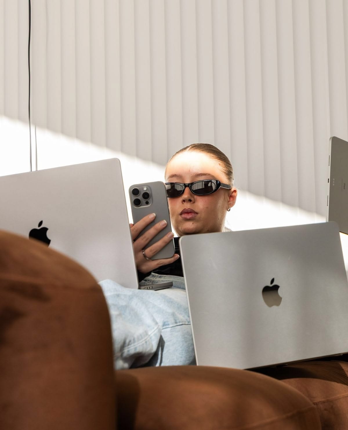 Two laptops open on a sunny afternoon