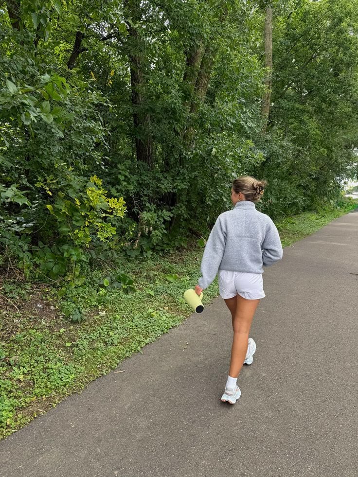 A walk along a tree-lined trail